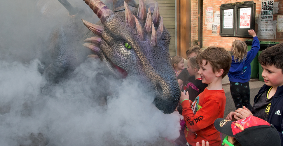 Smoke blowing Dragon in front of an audience
